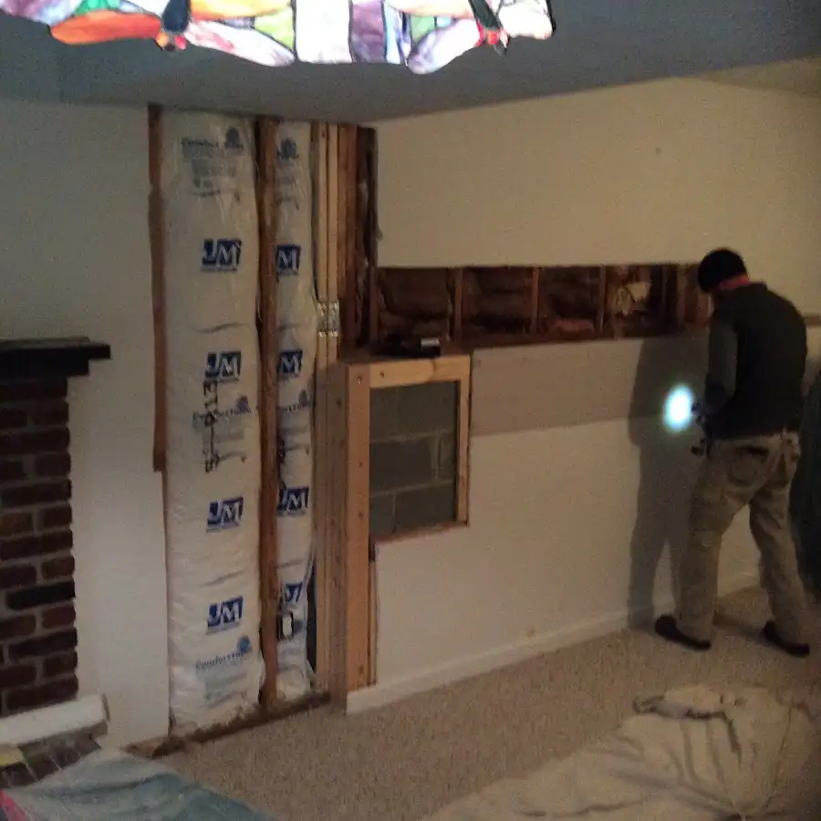 Restoration technician inspecting water damage in Princeton